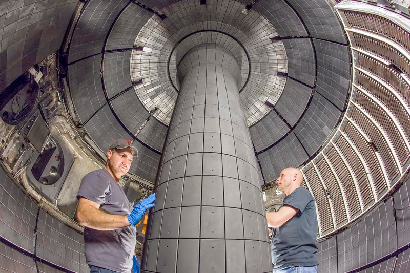 Technicians inspecting the installed center stack of the NSTX-U. Image: Elle Starkman/PPPL Office of Communications